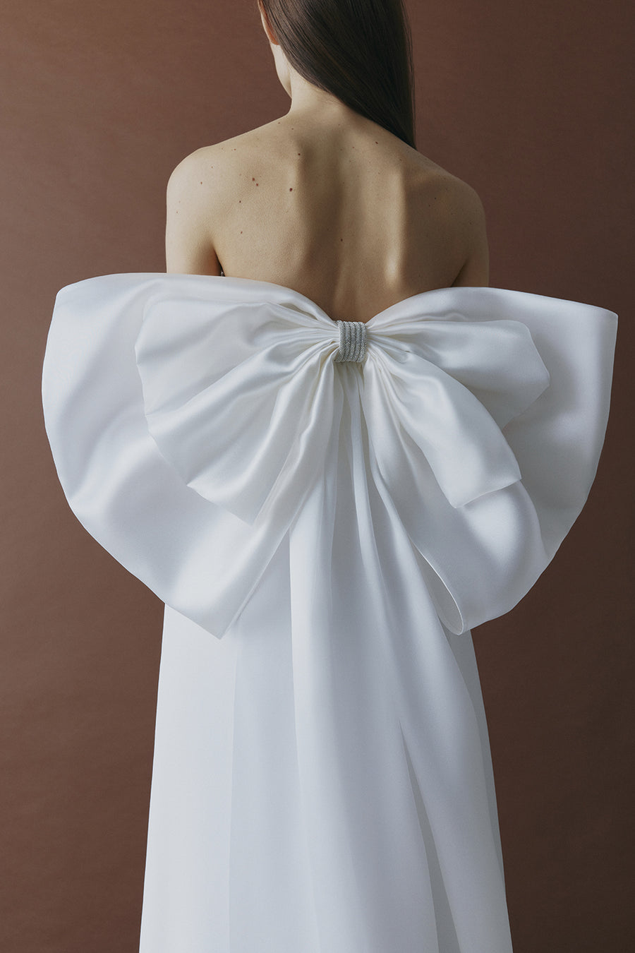 Dress with a featuring bow accent on the back